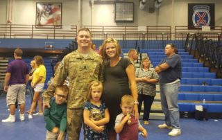 military member with family