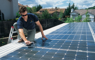 man installing solar on rooftop